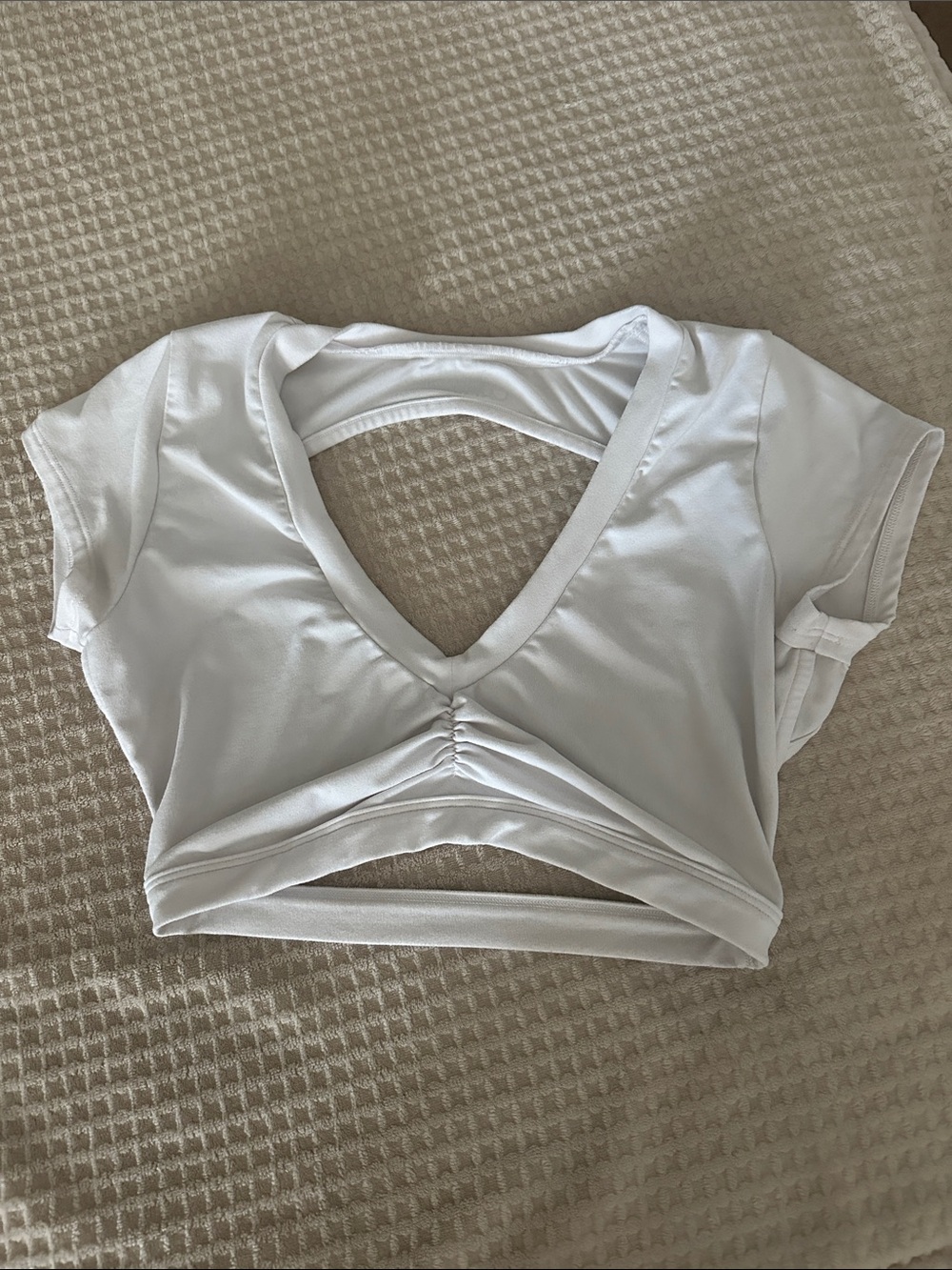 Bombshell Sportswear White Cropped V-Neck Twist Front Top